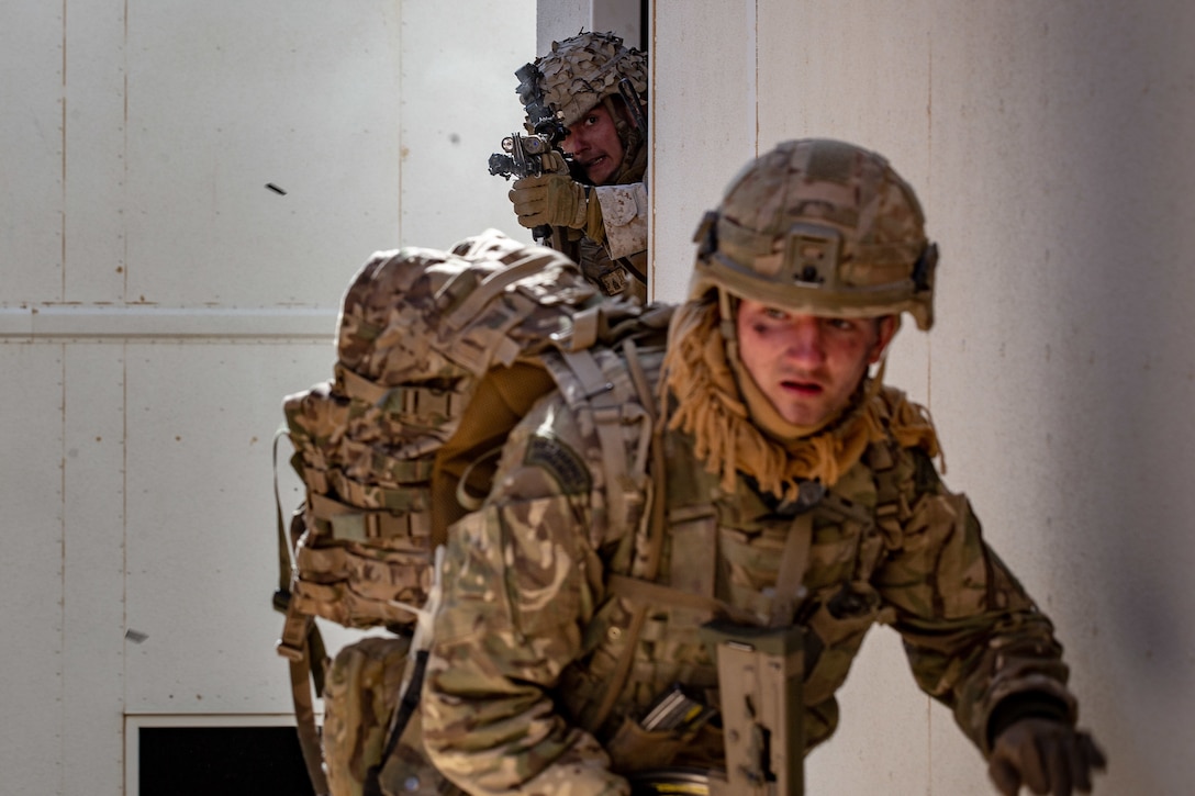 A U.S. Marine with 1st Battalion, 7th Marine Regiment, 1st Marine Division, takes control of a U.K. Royal Marine position during Integrated Training Exercise (ITX) 2-19 at Range 220, Marine Corps Air Ground Combat Center, Twentynine Palms, Calif. Feb. 9, 2019. ITX creates a challenging, realistic training environment that produces combat-ready forces capable of operating as an integrated Marine Air Ground Task Force. (U.S. Marine Corps photo by Cpl. Conner Downey)