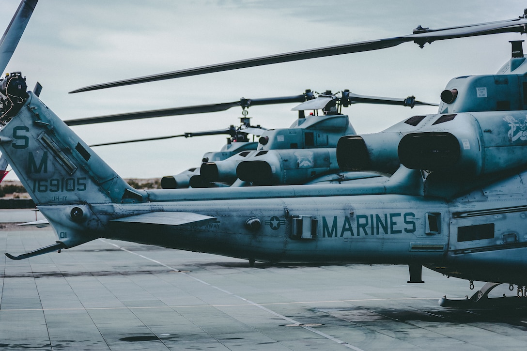 Three UH-1Y Venom helicopters with Marine Aircraft Group 13, 3rd Marine Aircraft Wing (3rd MAW) sit on the flightline in preparation for a training exercise at Marine Corp Air Ground Combat Center, Twentynine Palms, Calif., Feb 15, 2019. Exercises such as this provide realistic training necessary for 3rd MAW as the Marine Corps’ Largest aircraft wing and ensures the unit remains ready. (U.S. Marine Corps photo by Lance Cpl. Colton Brownlee)