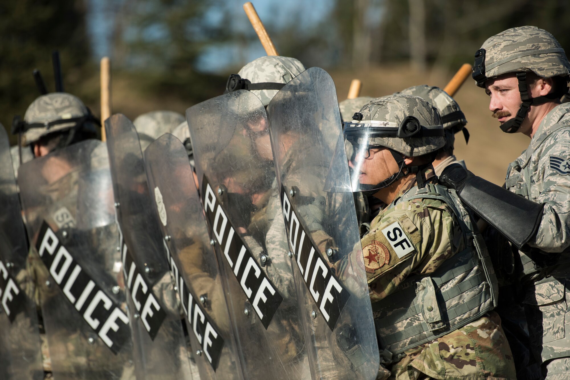 Joint Base Elmendorf-Richardson security forces personnel practice confrontation management scenario during a simulated protest for Polar Force 19-4 at Joint Base Elmendorf-Richardson, Alaska, April 1, 2019. The simulated protest began as a peaceful demonstration which escalated, resulting in a few aggressive protesters being detained. The exercise test the base’s ability to integrate, mobilize, and prepare assigned personnel, aircraft and equipment to handle real-world situations.