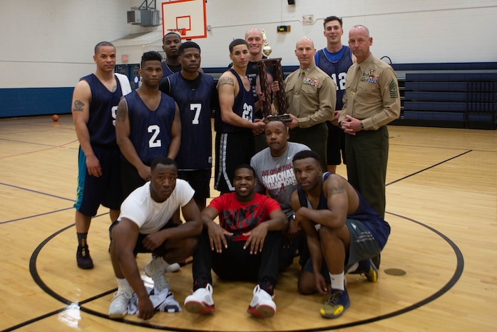 U.S. Marines with 2nd Marine Logistics Group, pose for a group photo at Camp Lejeune, N.C., March 29, 2019. Marines of 2nd MLG competed in the tournament to develop camaraderie through friendly competition. (U.S. Marine Corps photo by Cpl. Scarlet A. Sharp)