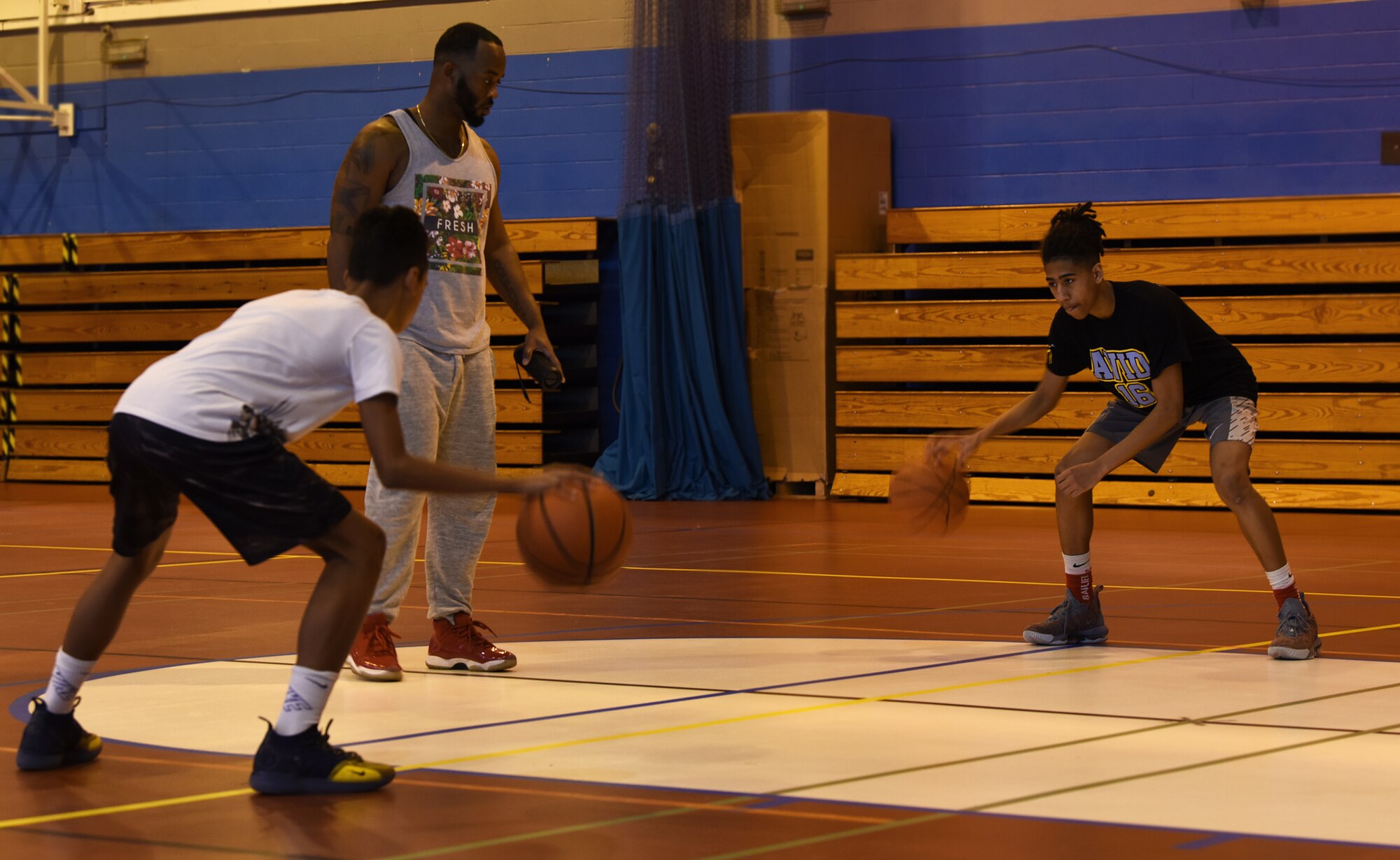 Kids part of the Out Work Everyone program practice ball handling skills at Royal Air Force Mildenhall, England, March 26, 2019. The youth performance sports program provides the children opportunities to play throughout the U.K. and other European countries. (U.S. Air Force photo by Airman 1st Class Madeline Herzog)