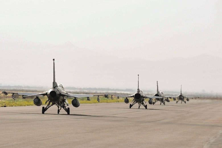 Four F-16C Fighting Falcons from the 555th Expeditionary Fighter Squadron taxi during exercise African Lion 2019 at Ben Guerir Air Base, Morocco.