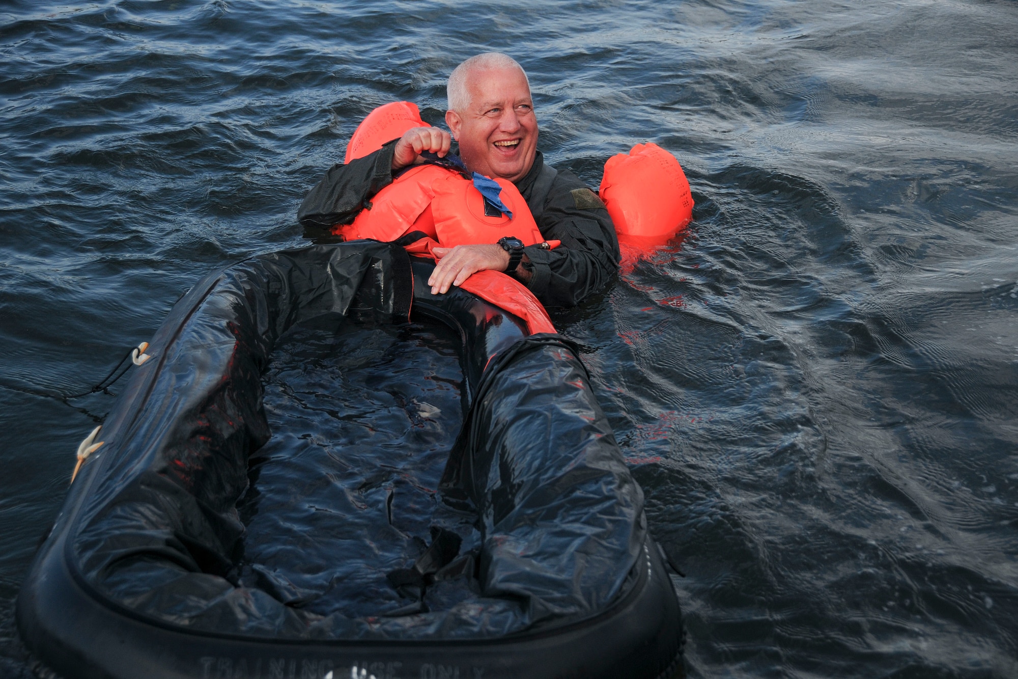 Master Sgt. Tom Rainwater, a 700th Airlift Squadron flight engineer, participates in Water Survival Training at Naval Air Station Key West, Florida March 27, 2019. During the water training members of the 94th Operations Group practiced on boarding one-man-rafts, maneuvering under a parachute, and mounting a 20-man life raft. (U.S. Air Force photo/Senior Airman Justin Clayvon)