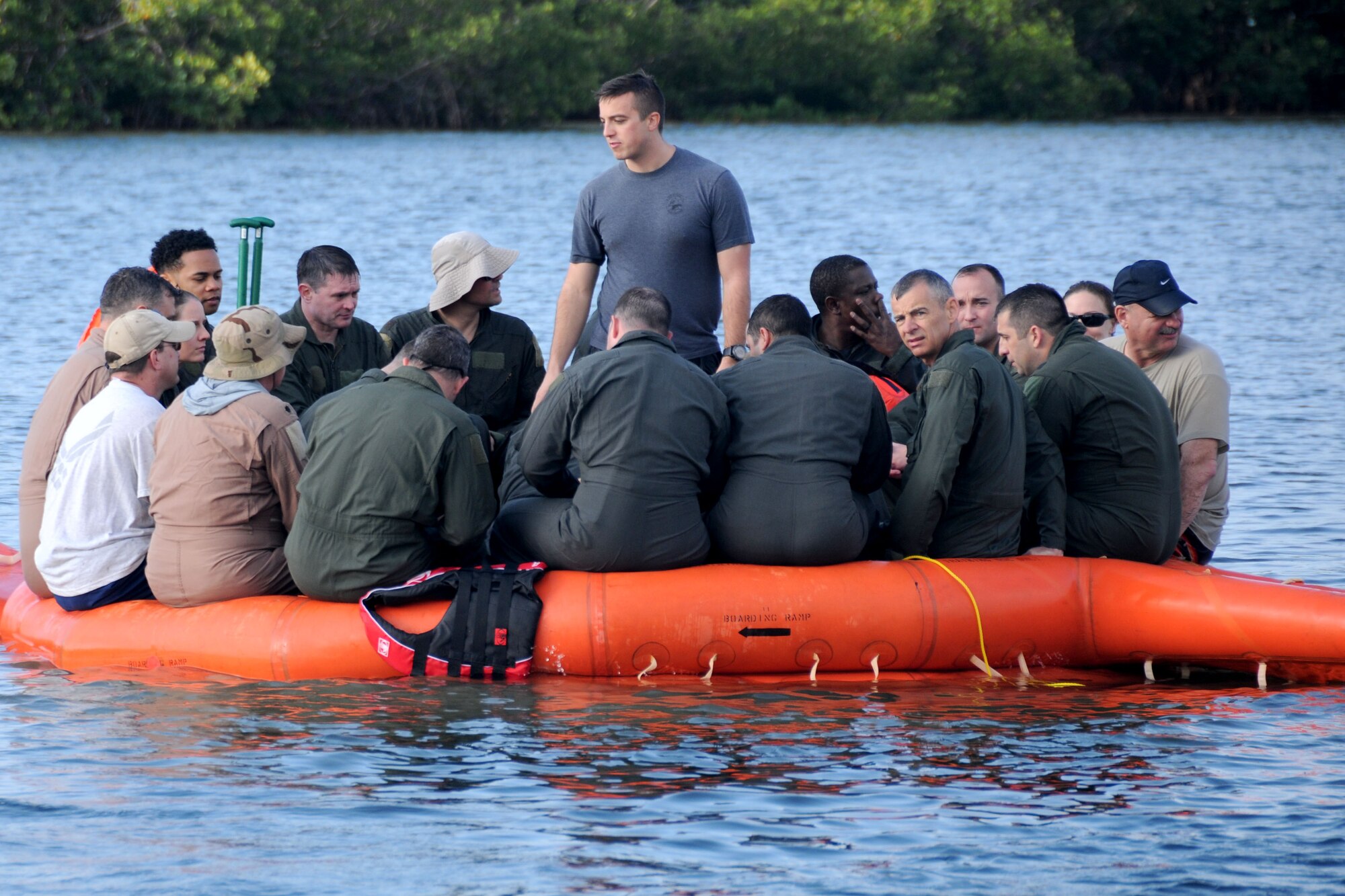 A Survival, Evade, Resistance and Escape trainer speaks with members of the 94th Operations Group during Water Survival Training at Naval Air Station Key West, Florida March 27, 2019. During the two-day Survival, Evasion, Resistance and Escape course SERE trainers and air flight equipment personnel led activities and ensured all the Airmen were prepared to handle the wide variety of emergency scenarios that can occur on the water. (U.S. Air Force photo/Senior Airman Justin Clayvon)