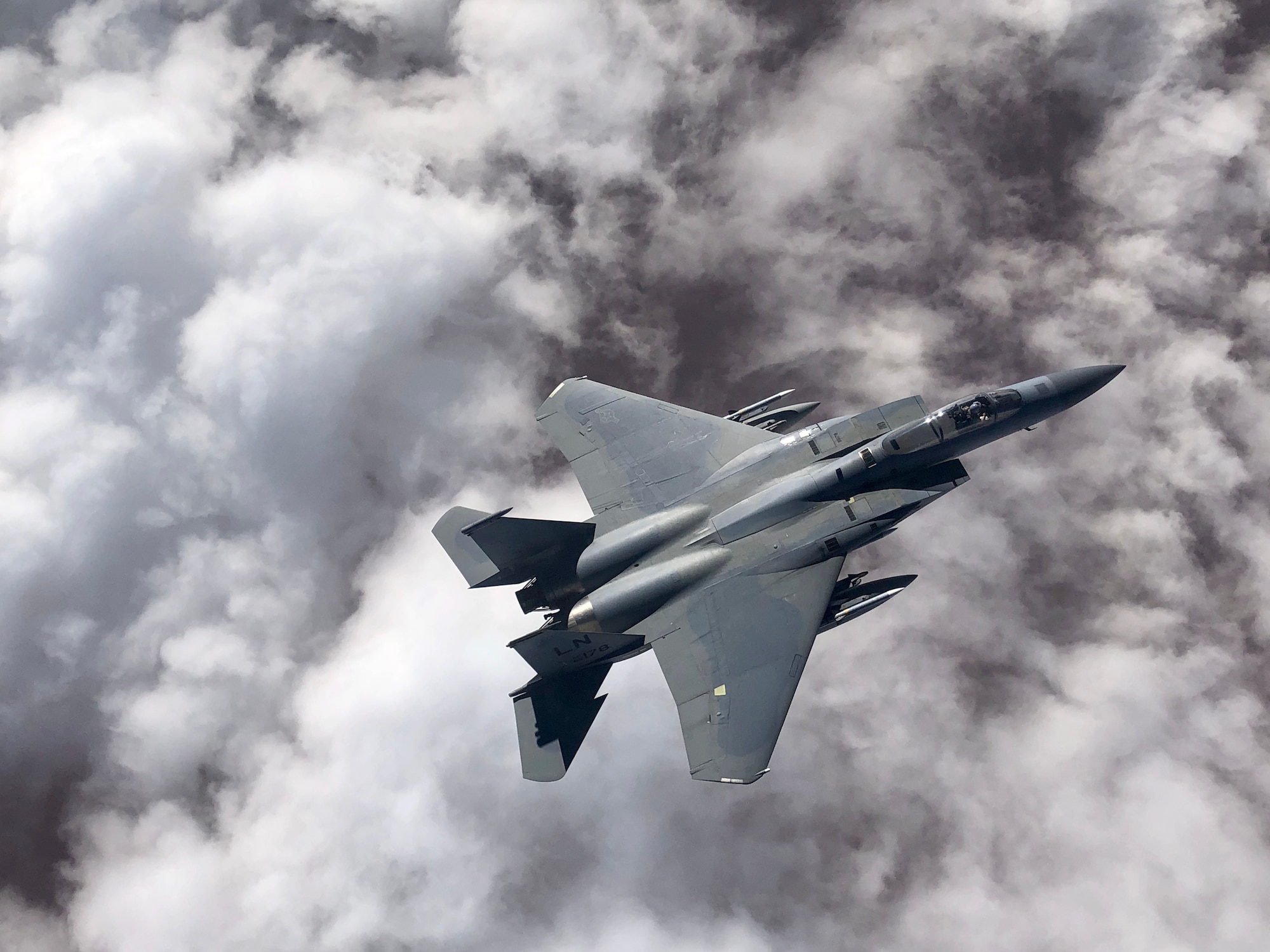 An F-15C Eagle flies over an undisclosed location in Southeast Asia in honor of the 493rd Fighter Squadron assumption of command for incoming commander Lt. Col. Anthony May during a mission supporting ongoing theater operations, February 28, 2019. The 493rd is a combat-ready squadron capable of executing air superiority and air defense missions in support of United States Air Forces in Europe, United States European Command, and NATO operations. (Courtesy photo)