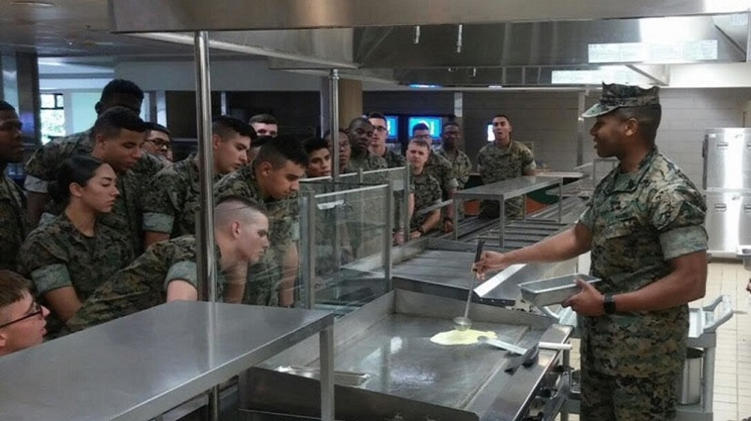 Master Sgt. Morris Mayfield instructs students in the school house for food service marines.