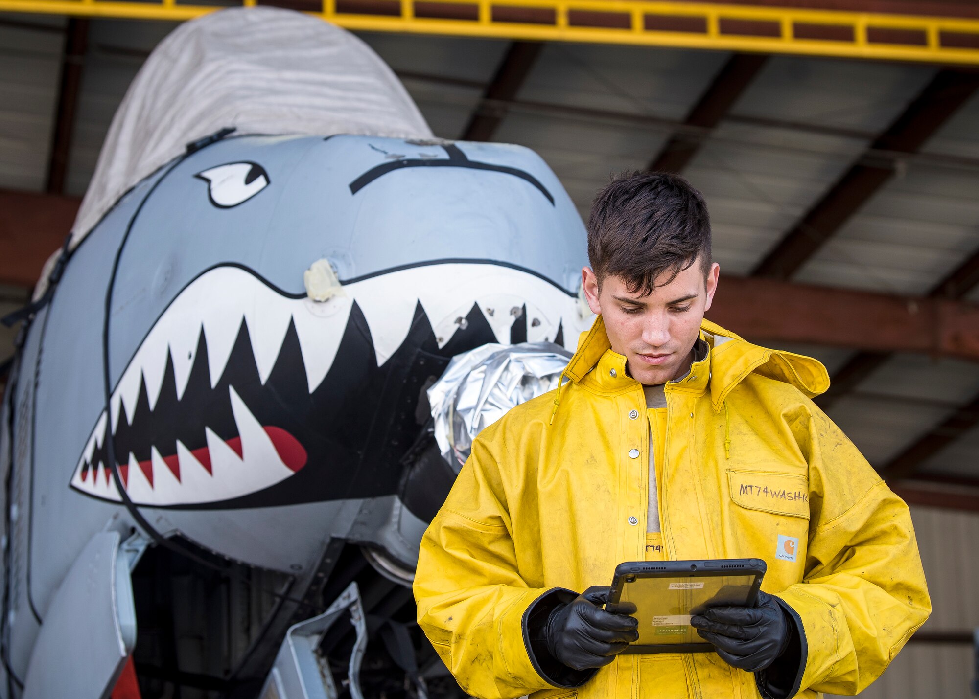 Airman 1st Class Benjamin Jones, 74th Aircraft Maintenance Unit crew chief, reads a technical order, Feb. 25, 2019, at Moody Air Force Base, Ga. To guarantee Moody’s fleet of 49 A-10C Thunderbolt II’s are in peak warfighting condition, Airmen from the 23d Maintenance Group dedicated over 10 hours washing the A-10 to ensure the aircraft is free of any surface or structural deficiencies that could present a safety hazard during flight. (U.S. Air Force photo by Airman 1st Class Eugene Oliver)