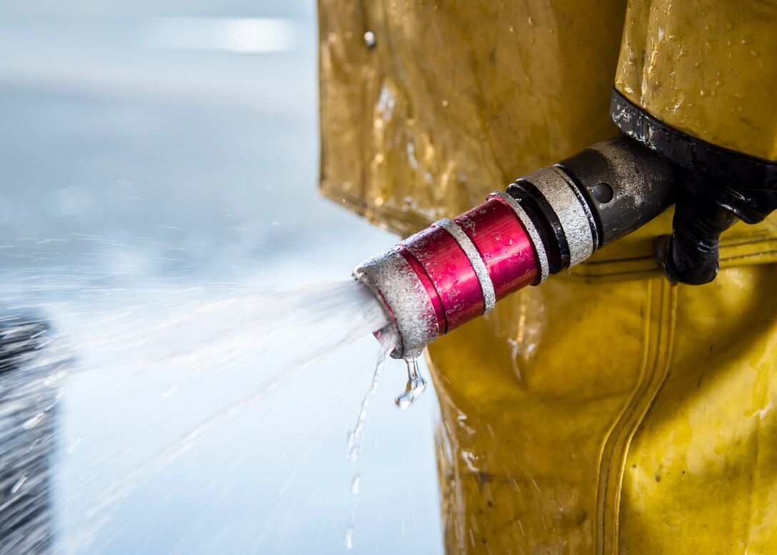 An Airman holds a hose during an A-10C Thunderbolt II wash, Feb. 25, 2019, at Moody Air Force Base, Ga. On top of their daily scheduled maintenance a team of six Airmen dedicated over 10 hours washing the A-10 to ensure the aircraft was free of any surface or structural deficiencies that could present a safety hazard during flight. (U.S. Air Force photo by Airman 1st Class Eugene Oliver)