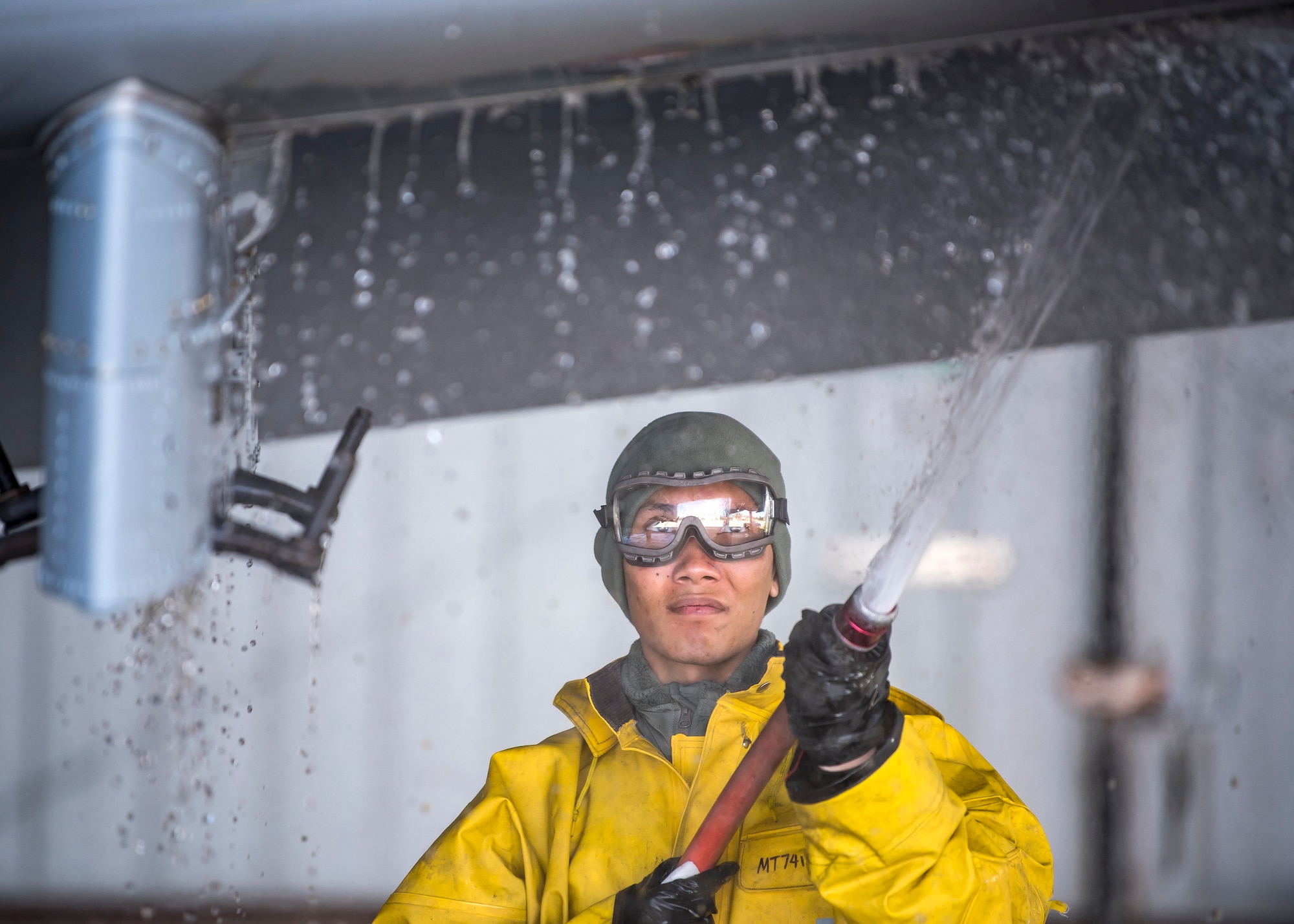 Airman 1st Class Anjo Betitia, 74th Aircraft Maintenance Unit crew chief, sprays the wing of an A-10C Thunderbolt II, Feb. 25, 2019, at Moody Air Force Base, Ga. A-10s require a wash every 180 days, or 1,000 flying hours, in order to control corrosion and grease build up within the aircraft. (U.S. Air Force photo by Airman 1st Class Eugene Oliver)