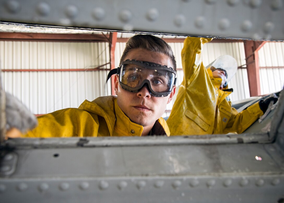 Airmen from the 74th Aircraft Maintenance Unit wash an A-10C Thunderbolt II, Feb. 25, 2019, at Moody Air Force Base, Ga. On top of their daily scheduled maintenance a team of six Airmen dedicated over 10 hours washing the A-10 to ensure the aircraft was free of any surface or structural deficiencies that could present a safety hazard during flight. (U.S. Air Force photo by Airman 1st Class Eugene Oliver)