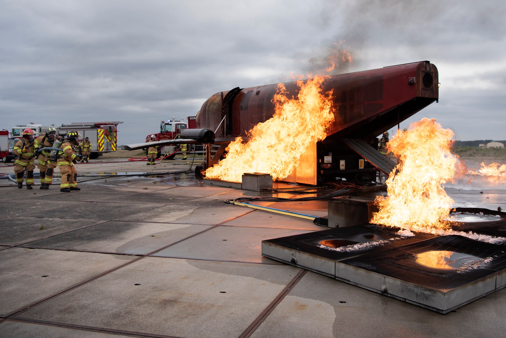 U.S. Air Force Airmen assigned to the 52nd Civil Engineer Squadron Fire Department conduct live-fire aircraft burn training at Spangdahlem Air Base, Germany, March 26, 2019. Live-fire exercises help firefighters learn how to extinguish engine or fuel pool fires. (U.S. Air Force photo by Airman 1st Class Valerie Seelye)