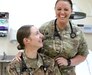 Capt. Heather Meier, 452d Combat Support Hospital, laughs with one of her preceptors, Capt. Laura Davis, at Camp Arifjan, Kuwait, Mar. 14, 2019. Meier recently graduated from Jefferson College Physician Assistant Program with a master's degree. She completed her clinical rotations during her deployment in support of Operation Spartan Shield.