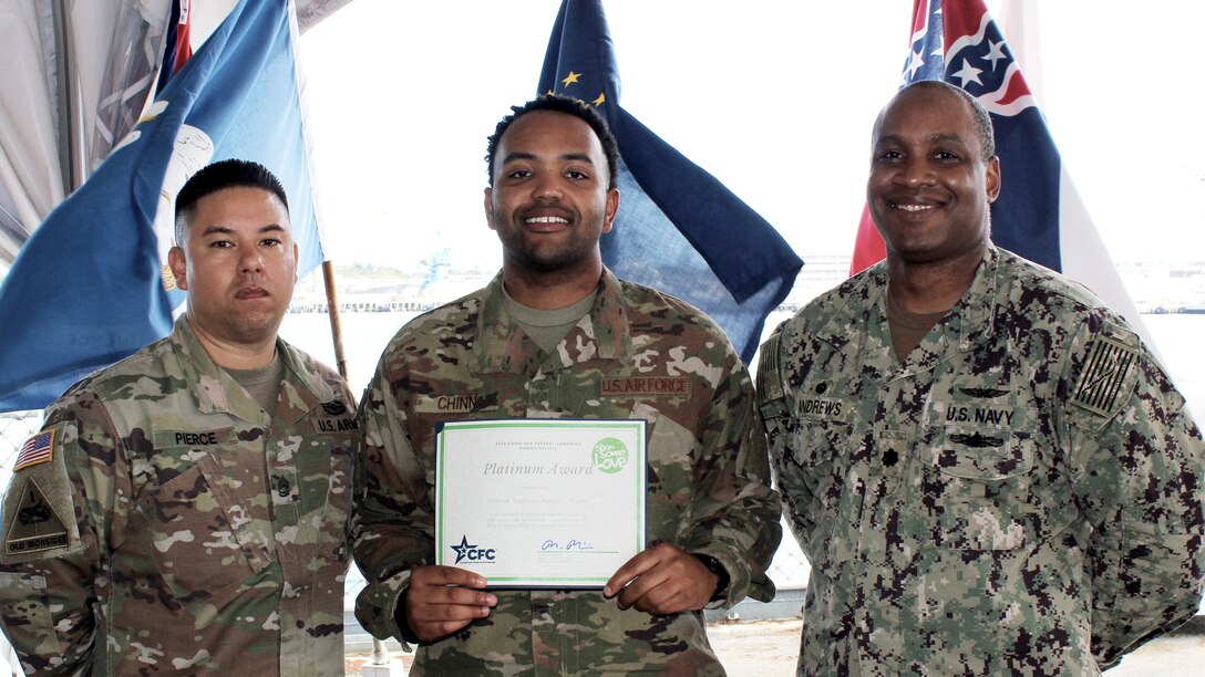 Three men pose during Hawaii-Pacific CFC award ceremony.