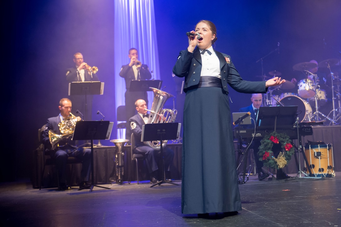 Airman First Class Aliyah Richling performs with the USAF Heartland of America Band during a performance in Council Bluffs, IA.