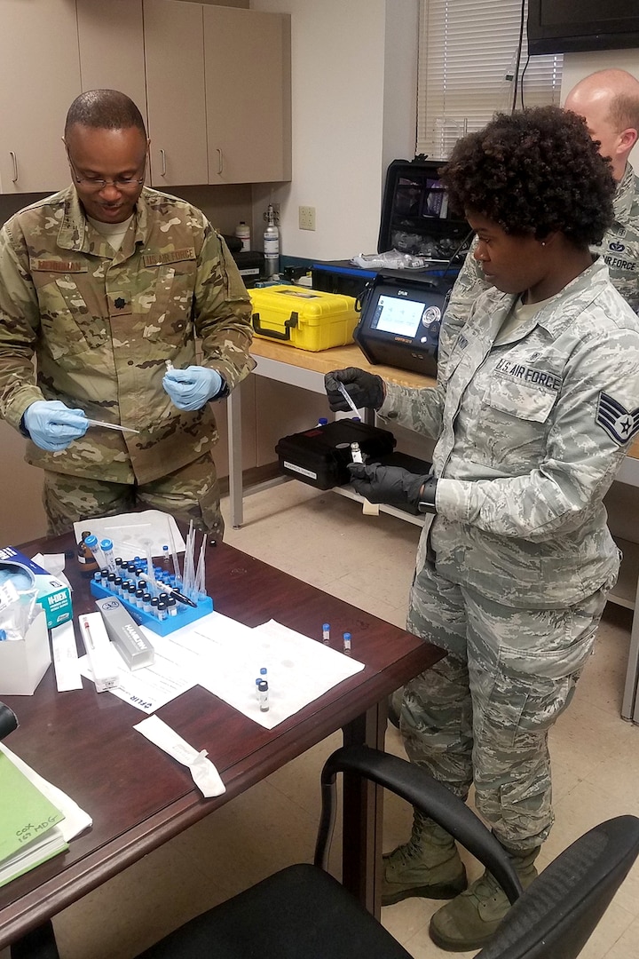 U.S. Air Force Lt. Col. James Merriman, a bioenvironmental engineer and Staff Sgt. Kimberly Backmon, a bioenvironmental technician with the 169th Medical Group, train with the new portable FLIR G510 Gas Chromatograph Mass Spectrometer system March 12, 2019.