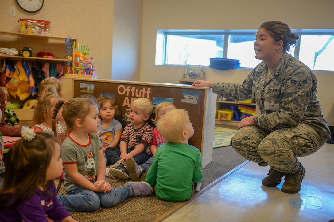 From the USAF Heartland of America Band, A1C Aliyah Richling entertains children from the Offutt AFB Child Development Center with seasonal holiday music.