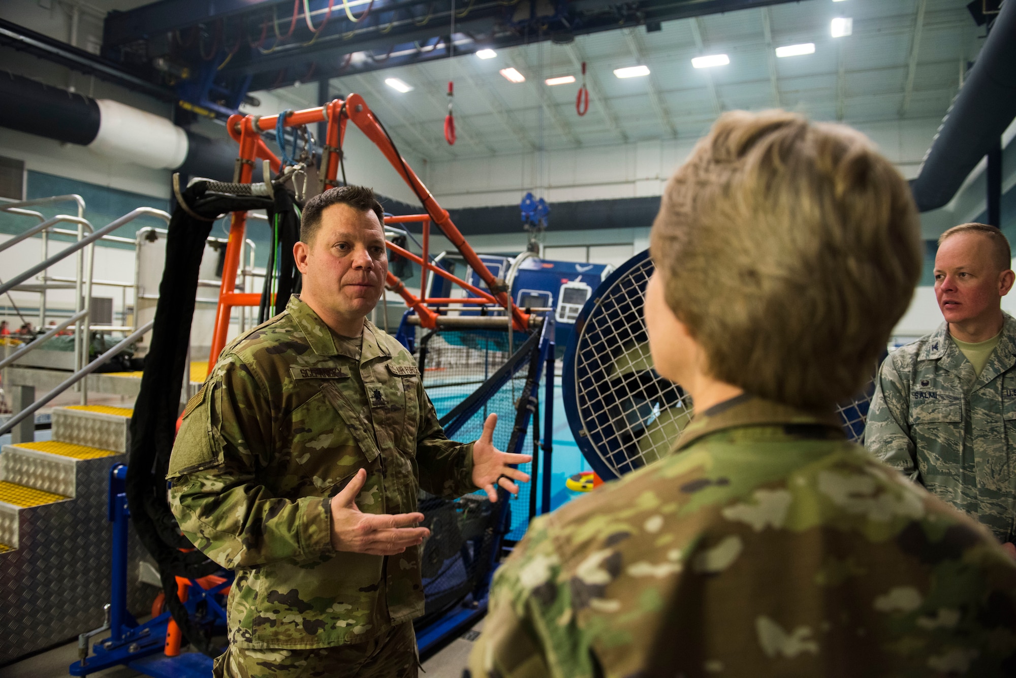 U.S. Air Force Lt. Col. Mark Scepansky, 336th Training Group deputy commander, briefs Gen. Maryanne Miller, Air Mobility Command commander, about the Survival, Evasion, Resistance and Escape water survival course at Fairchild Air Force Base, Washington, March 27, 2019. Miller’s visit offered additional exposure to the variety of missions and challenges Fairchild Airmen from the 92nd Maintenance Group, 92nd Operations Group and SERE face every day to successfully complete the mission. (U.S. Air Force photo by Airman 1st Class Lawrence Sena)