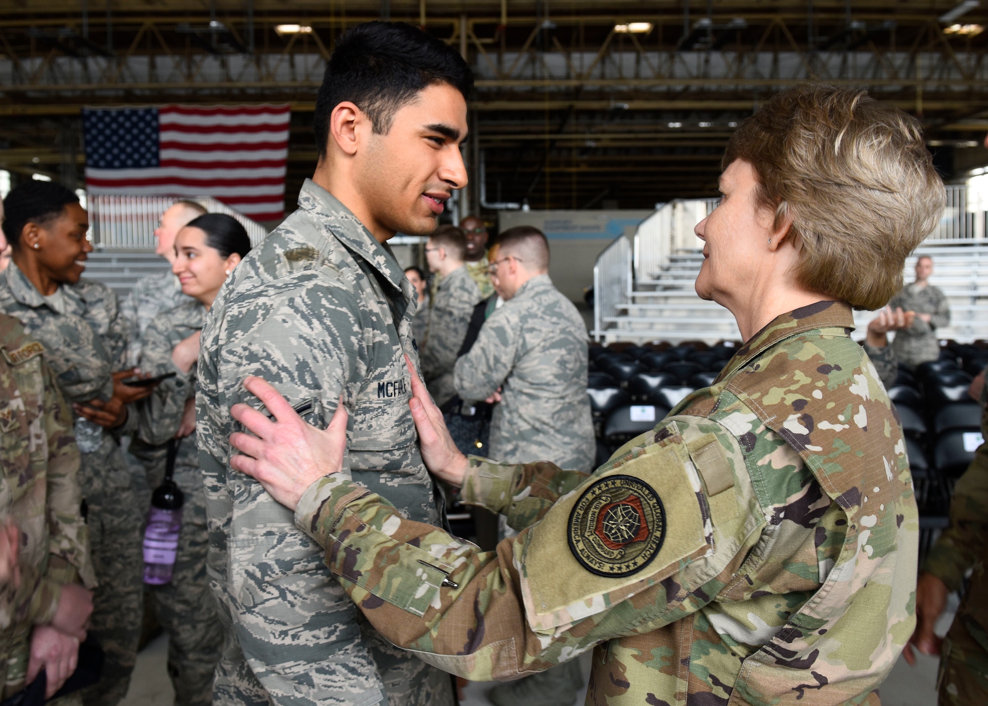 U.S. Air Force Gen. Maryanne Miller, Air Mobility Command commander, speaks with U.S. Air Force Airman Sean McFarlene, 92nd Maintenance Squadron isochronal crew chief, after an all-call at Fairchild Air Force Base, Washington, March 28, 2019. After addressing the challenges and concerns of Airmen, Miller took time for Fairchild Airmen to meet and speak with her one-on-one. (U.S. Air Force photo by Airman 1st Class Lawrence Sena)