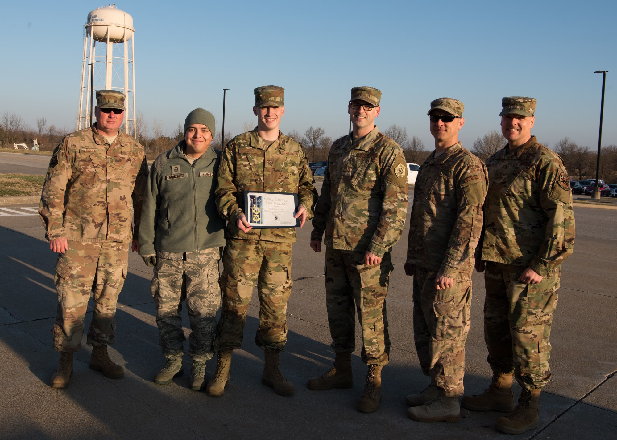 Senior Airman Dillon Lund, a low observable journeyman with the 509th Maintenance Squadron poses for a group photo after receiving the Chief’s Choice Award for February 2019.