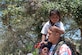 U.S. Army Lt. Col. Alex Duran, J3 Joint Operations Director, helps one of the local children on the trip down the mountain during Chapel Hike 78 in La Paz, Honduras, March 30, 2019.