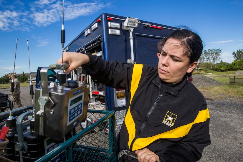 Woman holds air-monitoring device