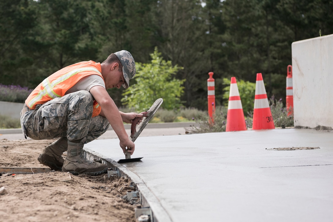 Airman 1st Class Devin Bergeron, 30th Civil Engineering Squadron Airman, lays concrete April 3, 2019, on Vandenberg Air Force Base, Calif. Bergeron helps maintain Vandenberg AFB along with making repairs and upgrades when needed. (U.S. Air Force photo by Airman 1st Class Hanah Abercrombie)