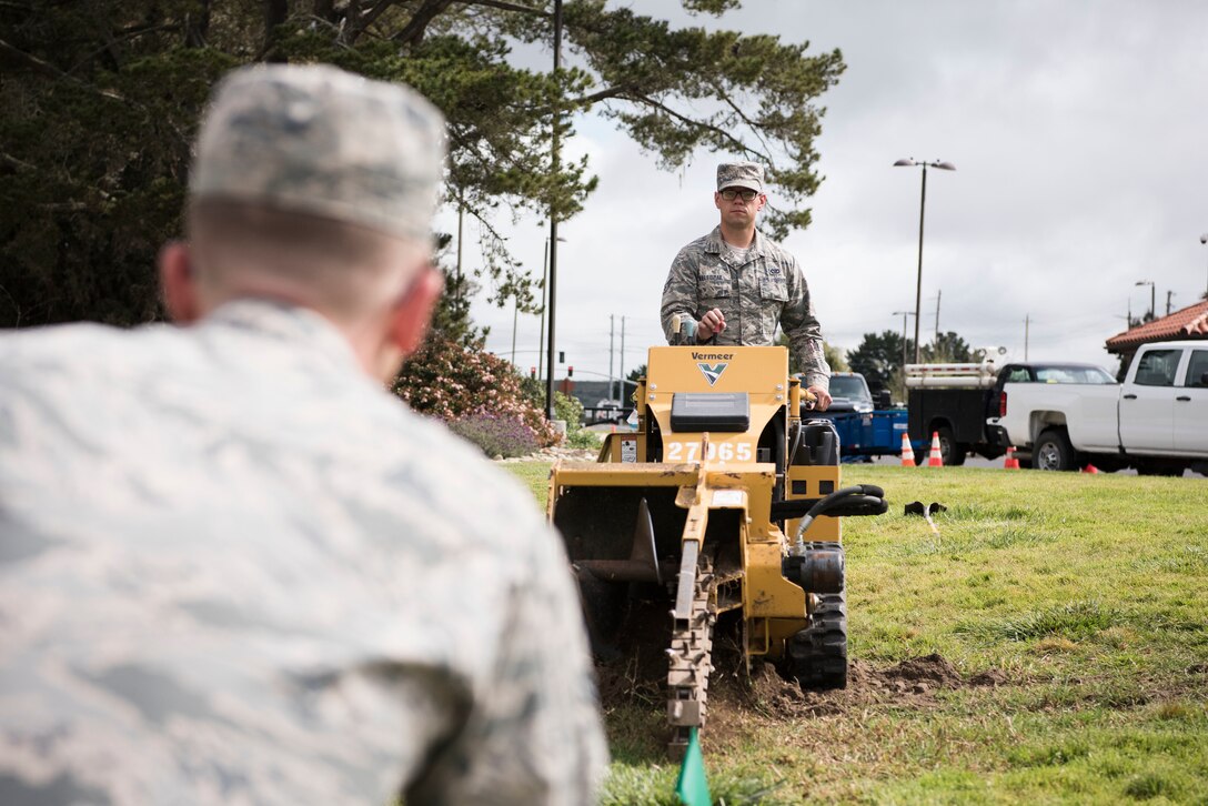 Airman 1st Class Rafael Waledziak, 30th Civil Engineering Squadron, operates machinery during base repairs April 3, 2019, on Vandenberg Air Force Base, Calif. Waledziak helps maintain Vandenberg AFB along with making repairs when needed. (U.S. Air Force photo by Airman 1st Class Hanah Abercrombie)