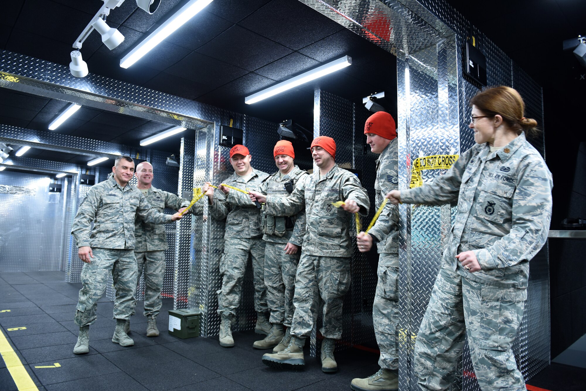 Members assigned to the 180th Fighter Wing Security Forces Squadron, Ohio Air National Guard, officially open the Modular Small Arms Range during a ribbon cutting ceremony in Swanton, Ohio, Nov. 30, 2018. The MSAR is used for weapons qualification providing the ability to conduct individual or mass weapons qualification, on site, in a single day minimizing the need to rent out a different location. (Air National Guard Photo by Senior Airman Hope Geiger)
