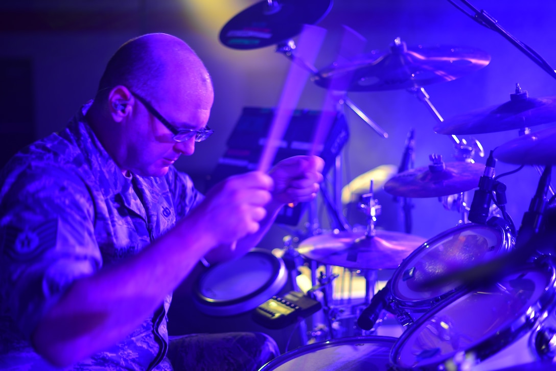 Technical Sergeant Jarrett Robinett, drums, performs with the USAF Heartland of America Band's popular music ensemble "Raptor."