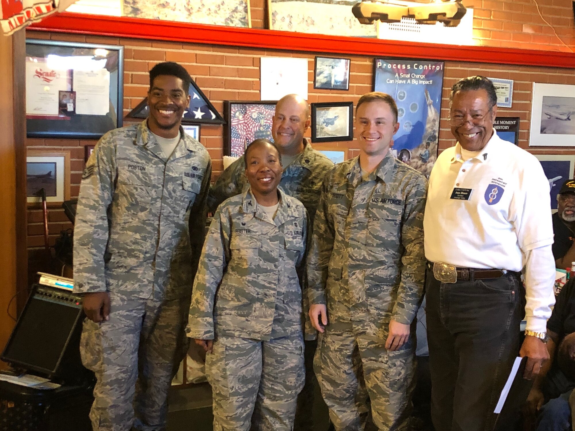 Staff Sgt. Laronald Poston, 412th Security Forces Squadron, Col. Gwendolyn Foster, 412th Medical Group commander, Lt. Col. Matthew Keysor, 412th MDG chief of medical staff, Master Sgt. Nicholas Scott, 412th Medical Support Squadron, and Juan Blanco, Coffee4Vets president, pose for a photo at a Coffee4Vets event in Lancaster, California, April 2. Coffee4Vets meets every Tuesday at Crazy Otto's Diner in Lancaster. It allows currently serving Airmen to engage with local Veterans and builds camaraderie. (U.S. Air Force photo by Danny Bazzell)