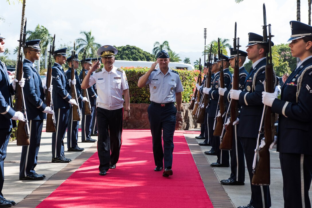 Commander of the Mongolian Air Force Command Brig. Gen. Enkhbayar Ochir and Pacific Air Forces Deputy Commander Maj. Gen. Russ Mack salute as they pass through the honor cordon at Headquarters PACAF, Joint Base Pearl Harbor-Hickam, Hawaii, March 26, 2019.