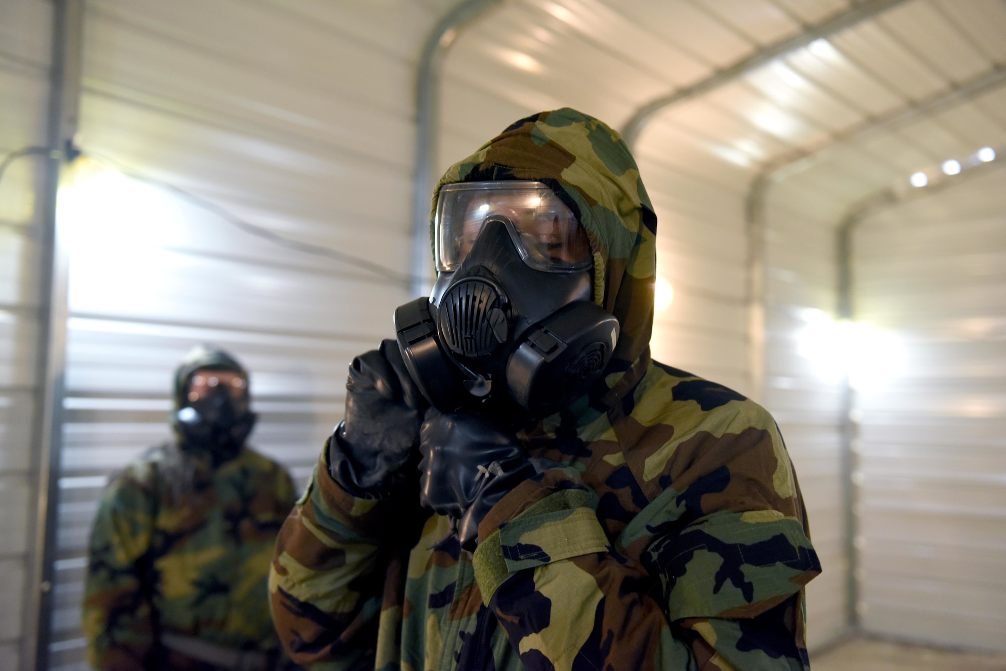 Staff Sgt. Kyaries Williams, 14th Security Forces Squadron, begins to take off his gas mask in the chamber, March 28, 2019, on Columbus Air Force Base, Miss. The Blaze Arena is the newest addition to Columbus Air Force Bases facilities in preparation for Airmen readiness. (U.S. Air Force photo by Senior Airman Beaux Hebert)
