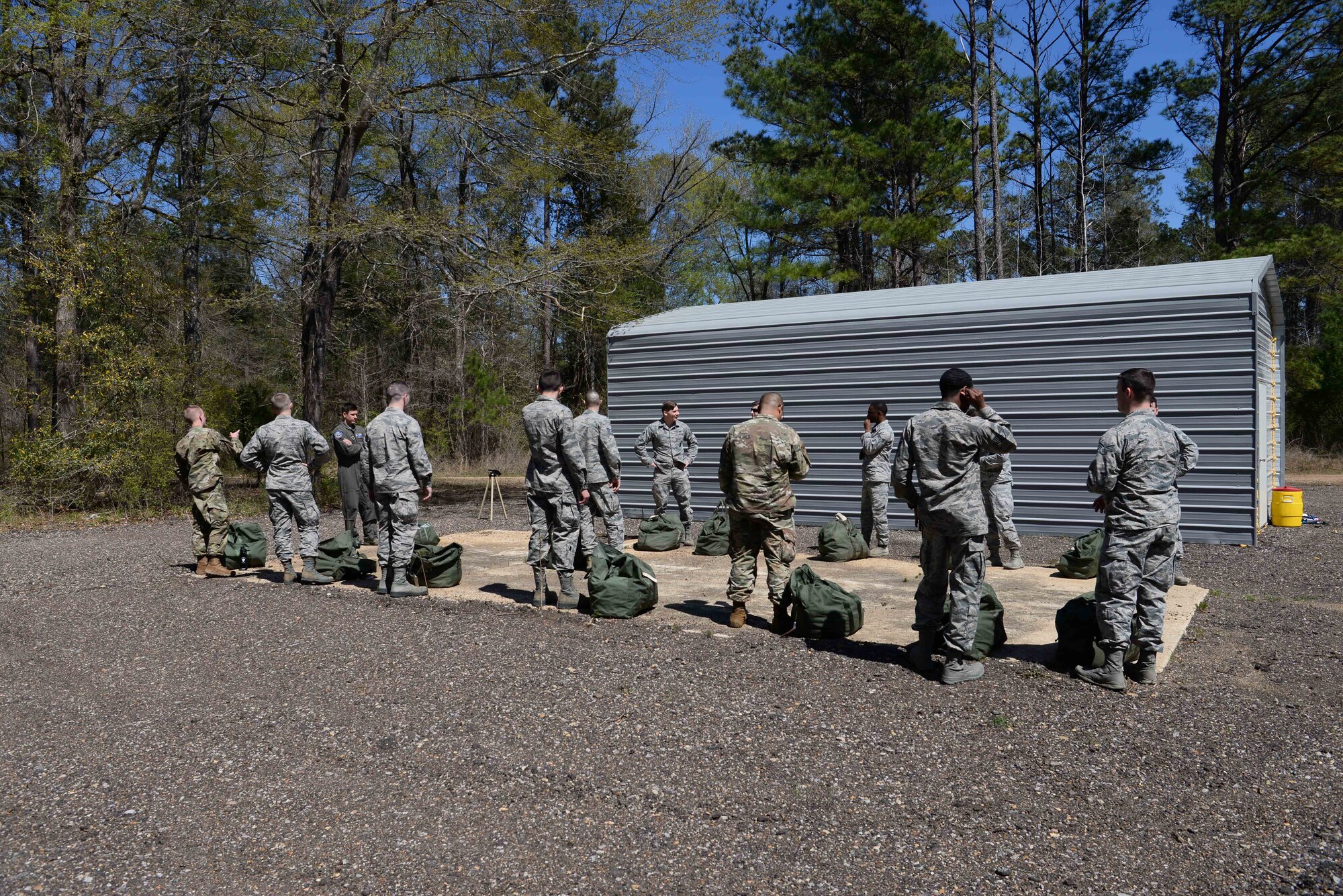 The first class for the Blaze Arena gas mask confidence chamber stands outside their bagged up gear, March 28, 2019, on Columbus Air Force Base, Miss. The 14th Civil Engineering Squadron worked the Blaze Arena operation for over a year and are one of two Air Education and Training Command bases with a gas mask confidence chamber. (U.S. Air Force photo by Airman 1st Class Jake Jacobsen)