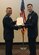 2nd Lt. Jordan Weum, 315th Training Squadron student, receives The Air Force Commendation Medal at his technical school graduation from Lt. Col. Mark Chang, 315th TRS commander at the Event Center on Goodfellow Air Force Base, Texas, April 4, 2019. The Air Force Commendation Medal is a military decoration which is awarded to an individual who demonstrates courage. (U.S. Air Force photo by Airman 1st Class Abbey Rieves/Released)