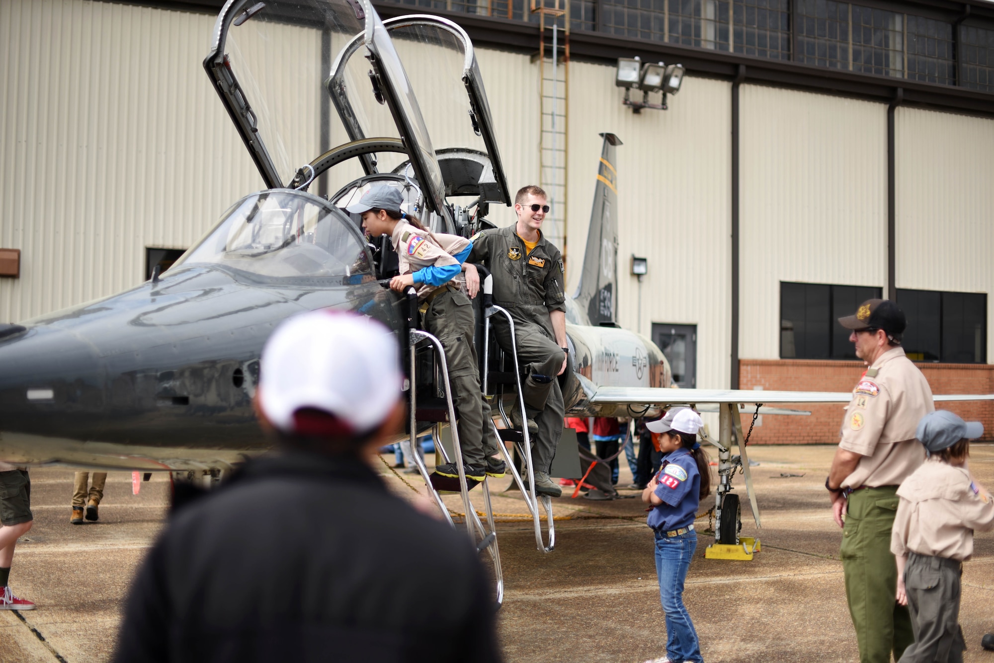 Scouts, Boy Scouts of America members look inside a T-38C Talon March 30, 2019, on Columbus Air Force Base, Mississippi. The scouts were able to see each training airframe the 14th Flying Training Wing uses to create the next generation of military aviators. (U.S. Air Force photo by Airman 1st Class Keith Holcomb)