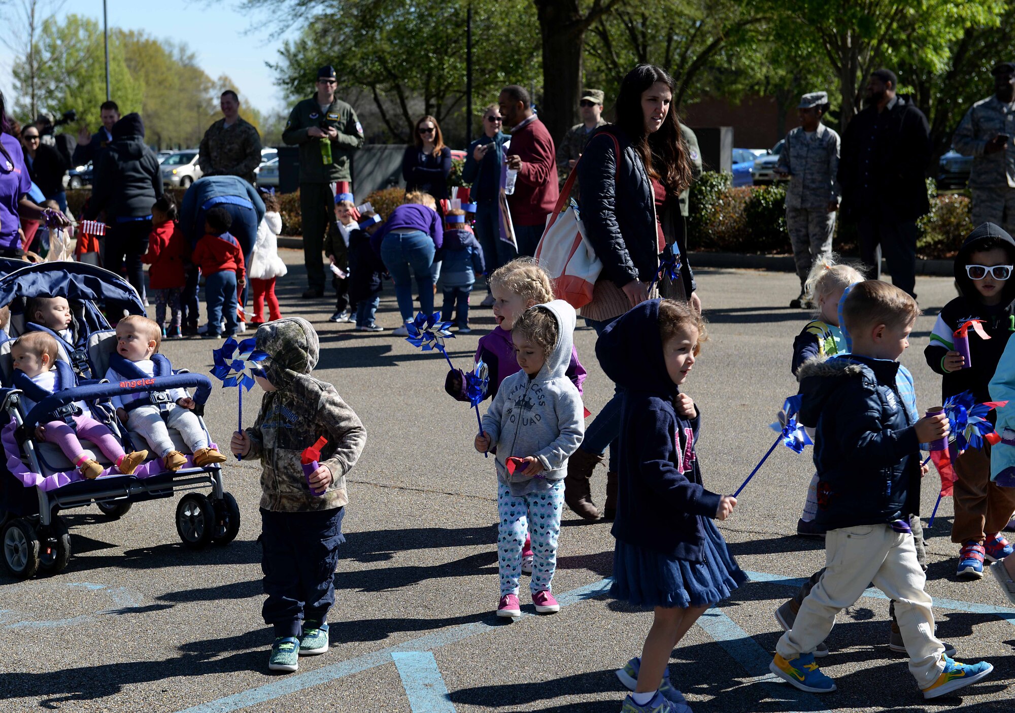 Children from the Child Development Center march in the Month of the Military Child parade April 1, 2019, on Columbus Air Force Base, Miss. The month of April is set aside every year as a time to honor and recognize the sacrifices made by military families worldwide, with an emphasis on dependent children whom experience military family members serving at home and overseas. (U.S. Air Force photo by Airman Hannah Bean)