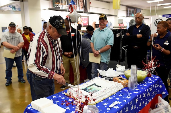 James Hardy, retired Army sergeant first class, cuts a cake during the 50th Vietnam Memorial Pinning Ceremony March 29, 2019, on Columbus Air Force Base, Miss. The ceremony, hosted by the Columbus AFB Base Exchange and Commissary, was in honor of the veterans and the 50th anniversary of the Vietnam War. (U.S. Air Force photo by Senior Airman Beaux Hebert)