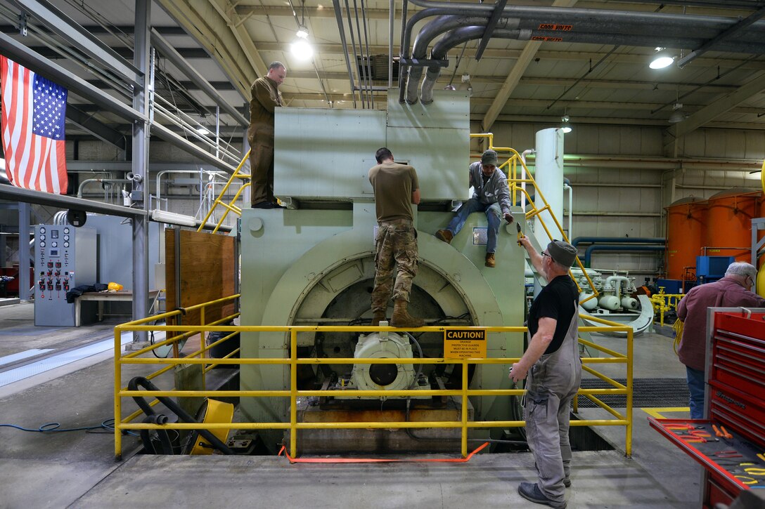 A Civil Engineer Maintenance Inspection Repair Team based out of Tyndall Air Force Base, Florida, inspect a three megawatt generator that was partially submerged in floodwaters that encroached through half of Offutt Air Force Base, Nebraska, March 29. 2019. The CEMIRT team is part of the Air Force Civil Engineer Center which is tasked with responding to emergency situations to ensure the operability of military installations around the globe. (U.S. Air Force photo by Josh Plueger)