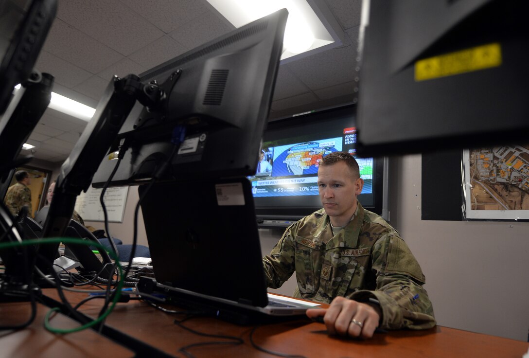 Master Sgt. Luke Nelson, 55th Force Support Squadron superintendent, relays pertinent flood information for the 55th FSS from the Recovery Operations Center March 19, 2019. The 55th Wing experienced record flooding, from the neighboring Missouri River, due to an unseasonable amount of snowfall and rapid melting. (U.S. Air Force Photo by Josh Plueger)