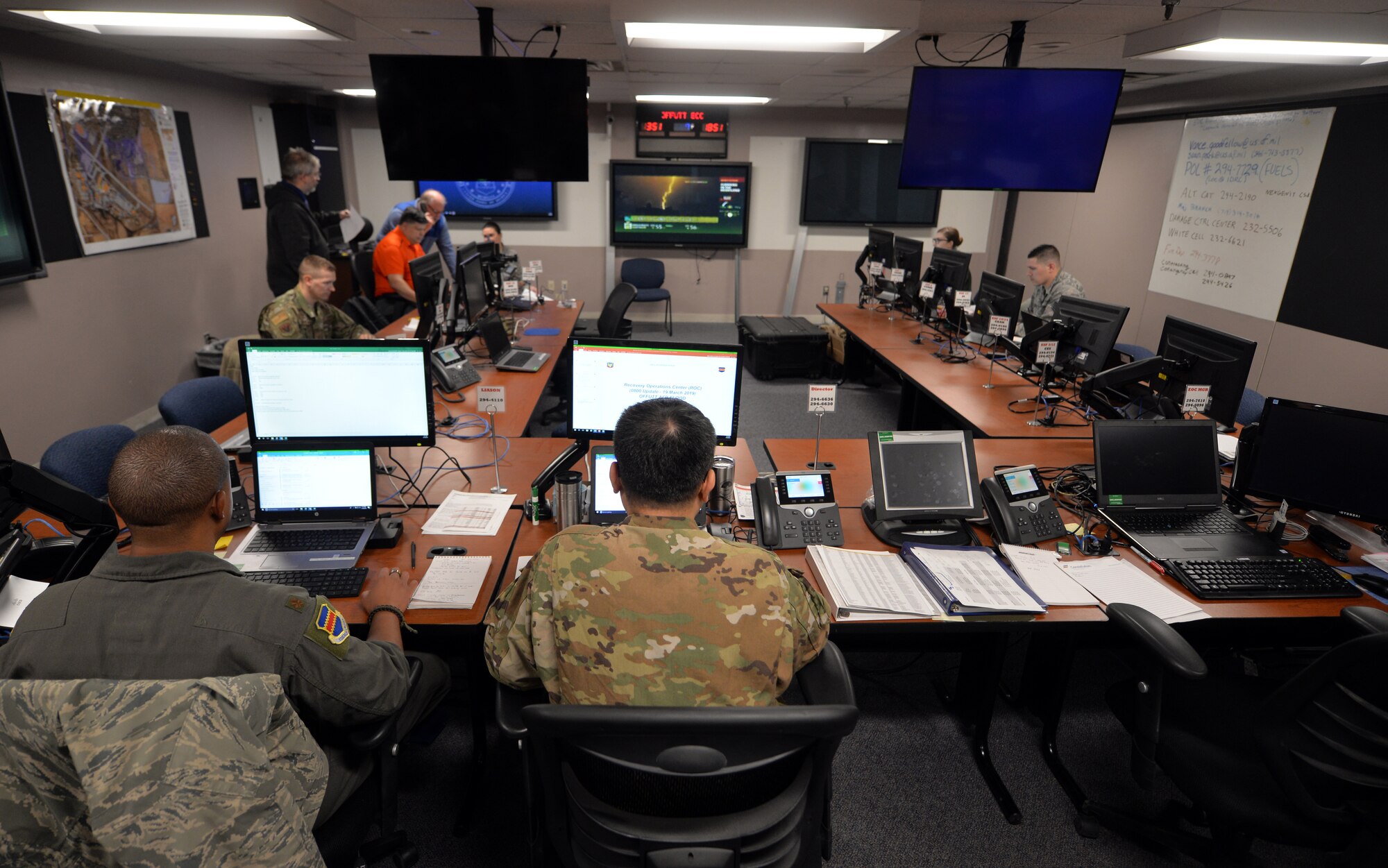 The 55th Wing’s Recovery Operations Center staff works 16-hour shifts disseminating pertinent information to the base populous regarding the flooding caused by the Missouri River on March 19, 2019. The Missouri River breached the levee system which widened the river’s footprint - covering one third of the base. (U.S. Air Force Photo by Josh Plueger)