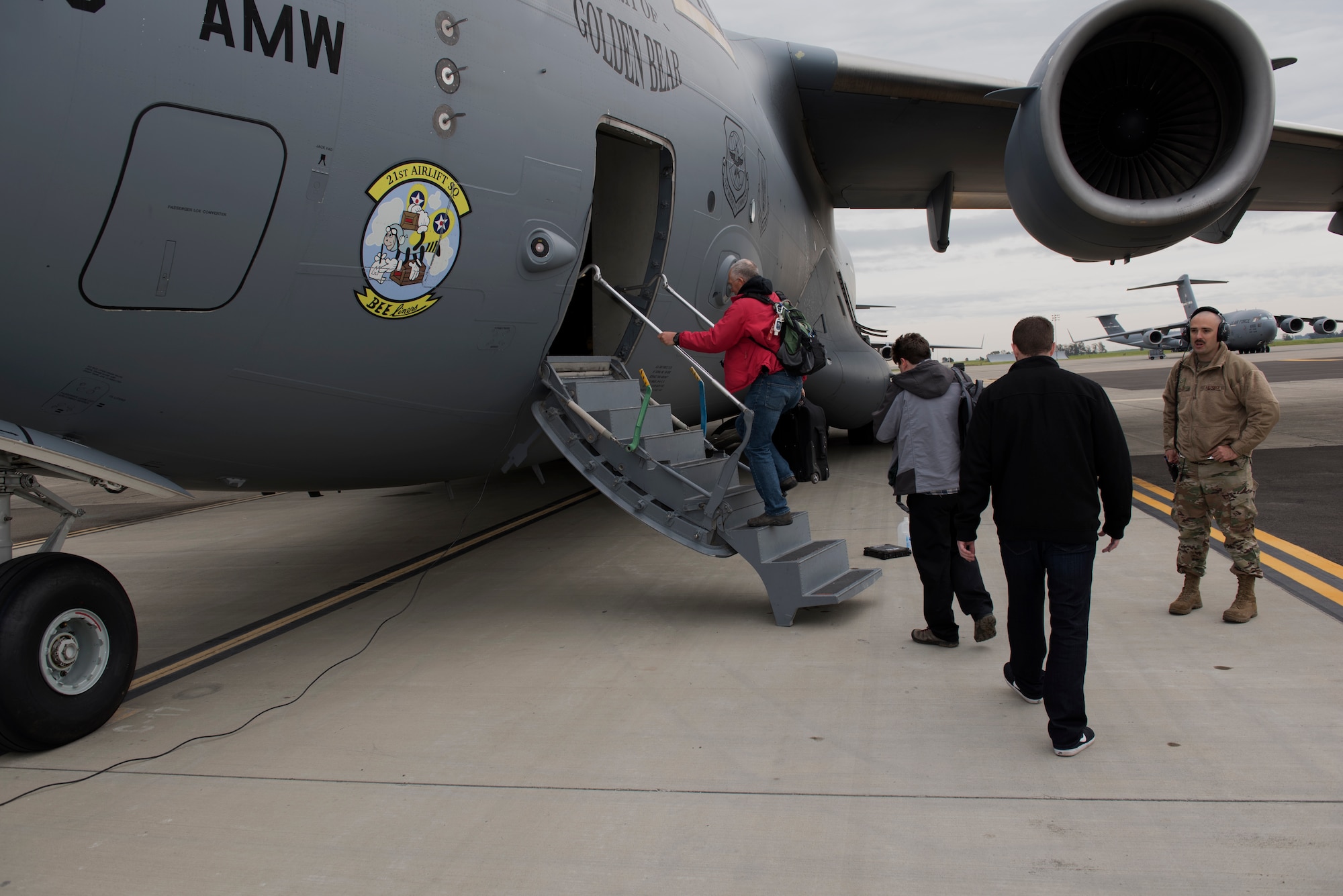 Hometown Heroes board a C-17 Globemaster III March 25, 2019, at Travis Air Force Base, California. This year Travis honored 27 individuals, nominated by their peers, to be Hometown Heroes for the “Thunder Over the Bay” Air Show. (U.S. Air Force photo by Airman 1st Class Cameron Otte)