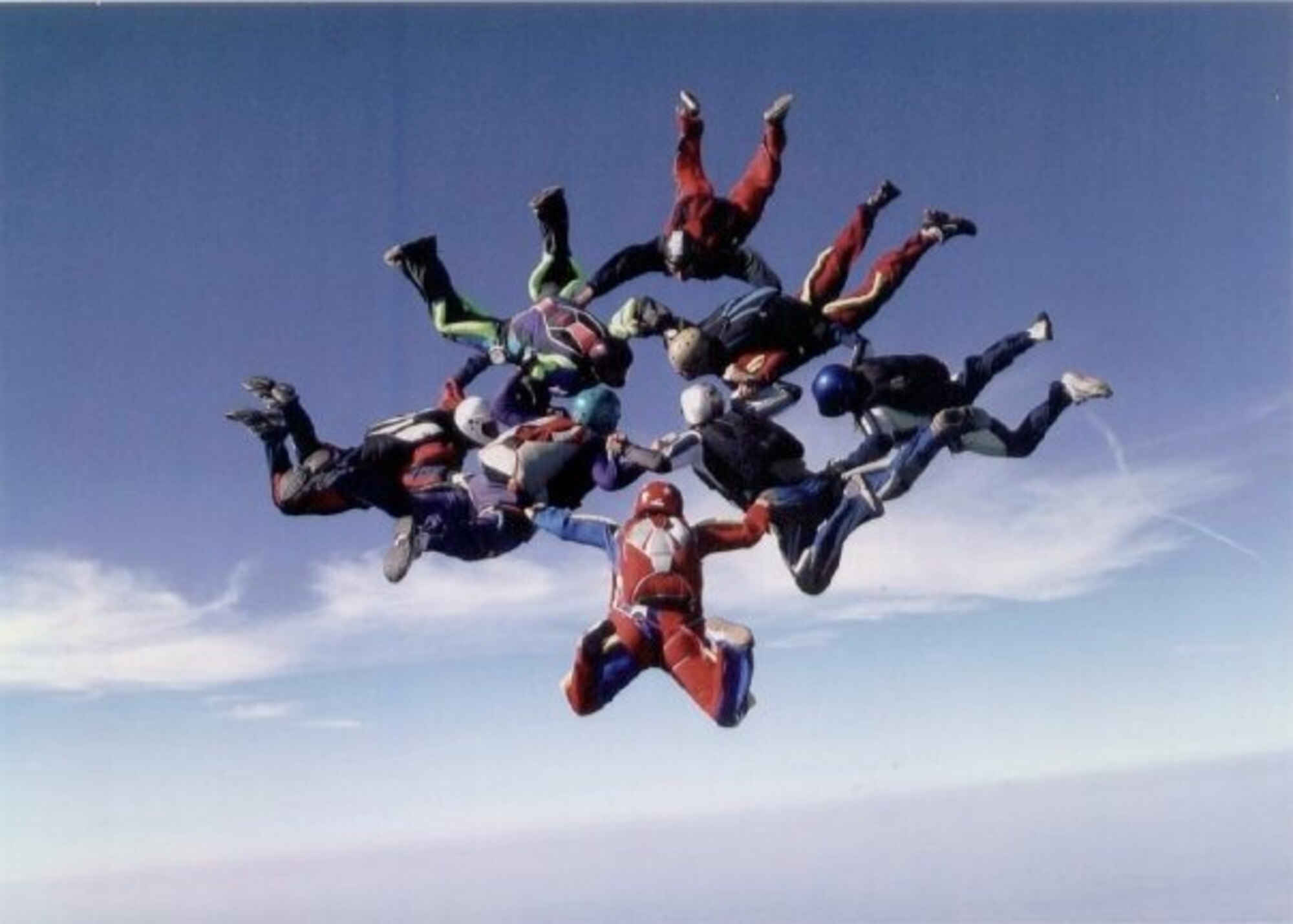 U.S. Air Force Maj. Donna Sicker, 374th Medical Group group practice manager and alternate sexual assault response coordinator out of Yokota Air Base, Japan, bottom center, completes a group formation jump over Fort Dodge, Iowa, Sept. 2007. With countless jumps throughout her skydiving career, Sickler would later discover how therapeutic jumping could be for her when it came to her reaching her new normal after being sexually assaulted in April of 2011. Through family, jumping and therapy, Sickler has used her own progress to help others address their own traumas and get the care they need with the Sexual Assault Prevention and Response program. (Courtesy photo by U.S. Air Force Maj. Donna Sickler)