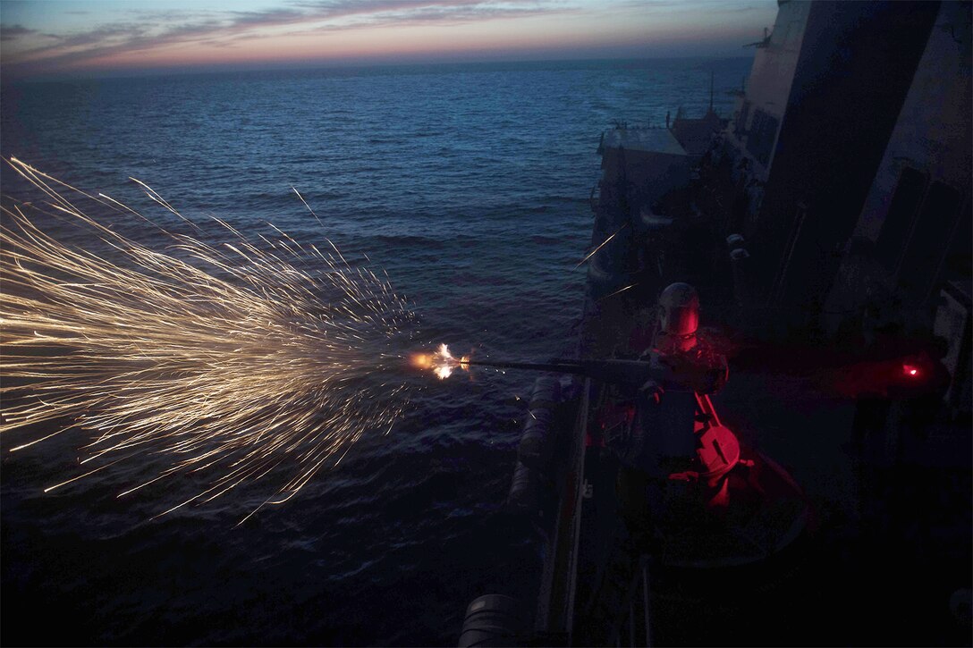 A ships fires its machine gun.