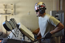 Senior Airman Christopher Monzon, 741st Maintenance Squadron mechanical and pneudraulics section team chief, manually pumps hydraulic pressure into a tensioner system to be proof loaded for operation March 18, 2019, at Malmstrom Air Force Base, Mont.