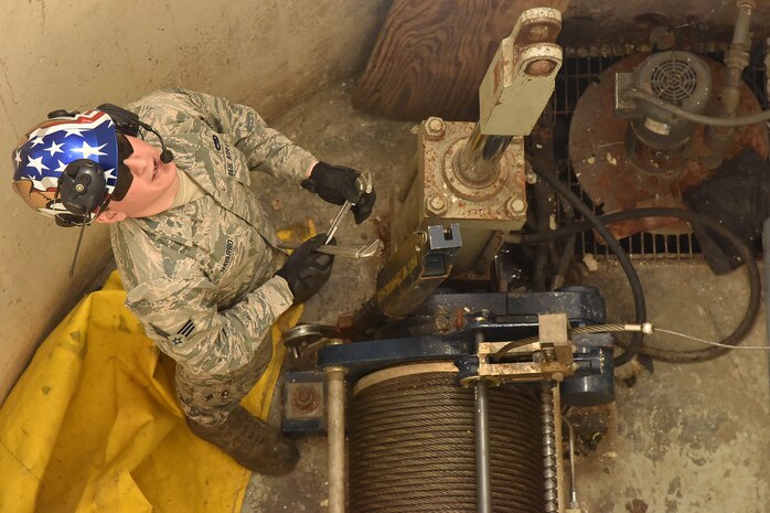 Senior Airman Steven Navarro, 741st Maintenance Squadron mechanical and pneudraulics section team chief, awaits a hoist to be lowered March 18, 2019, at Malmstrom Air Force Base, Mont.