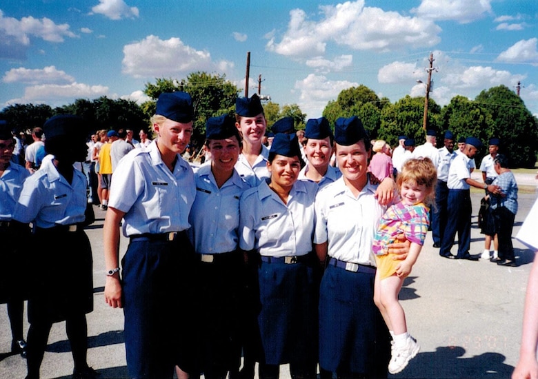 U.S. Air Force Chief Master Sgt. Andrea Inmon, 92nd Operations Group chief enlisted manager, poses for photo with Airmen from her basic military training flight after graduation. Inmon initially joined the Air Force in July 2001 for G.I. Bill benefits and to travel the world, but chose to make it a career when she discovered a new appreciation for her country and the men and women serving alongside her. (Courtesy Photo)