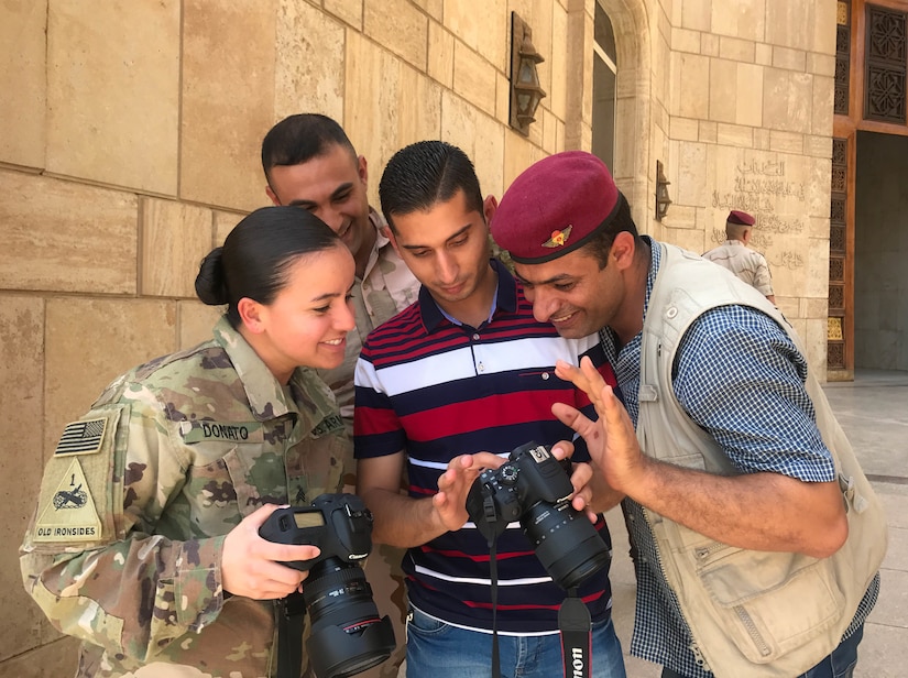 Sgt. Von Marie Donato, a public affairs non-commissioned officer assigned to Combined Joint Forces Land Component Command – Operation Inherent Resolve and 1st Armored Division, provides media and photography training to Iraqi security forces and media personnel at the Baghdad Operations Center in Baghdad, Iraq, Aug. 21, 2017. CJFLCC-OIR is a Coalition of 23 regional and international nations which have joined together to enable partnered forces to defeat ISIS in Iraq and restore stability and security.