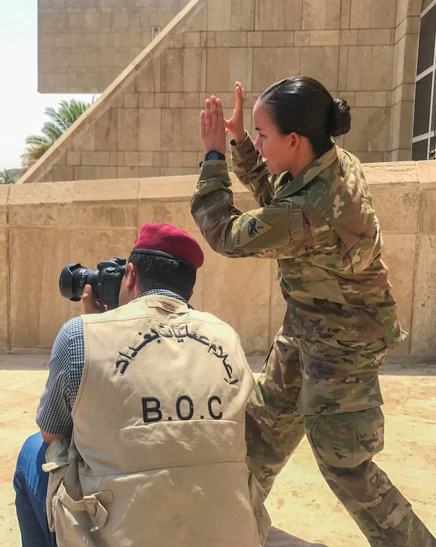Sgt. Von Marie Donato, a public affairs non-commissioned officer assigned to Combined Joint Forces Land Component Command – Operation Inherent Resolve and 1st Armored Division, provides media and photography training to an Iraqi security forces member at the Baghdad Operations Center in Baghdad, Iraq, Aug. 21, 2017. CJFLCC-OIR is a Coalition of 23 regional and international nations which have joined together to enable partnered forces to defeat ISIS in Iraq and restore stability and security.