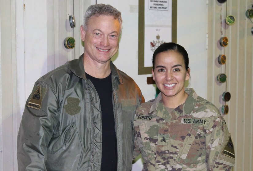 Actor Gary Sinise conducts a meet and greet with Sgt. Von Marie Donato, a public affairs non-commissioned officer assigned to Combined Joint Forces Land Component Command – Operation Inherent Resolve and 1st Armored Division, as he visits service members in Baghdad, Iraq, Dec. 20, 2017. The visit was part of a United Service Organization entertainment tour to promote morale and support military members.