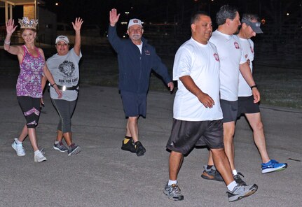 Fiesta Commission members walk to the start line for the two mile Health Readiness Center of Excellence 2019 Viva Fiesta Fun Run at Joint Base San Antonio-Fort Sam Houston April 5.
